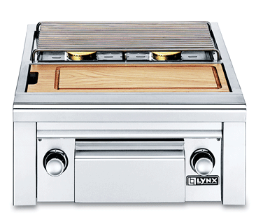 A lynx grill with a wooden cutting board on top