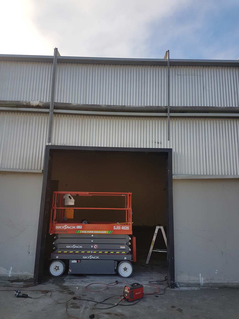 Garage door and scissor lift