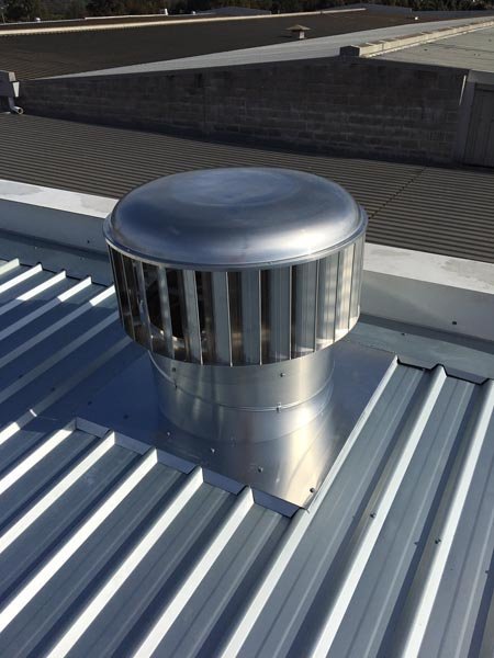 Top view of metal roof replacement  with air vent