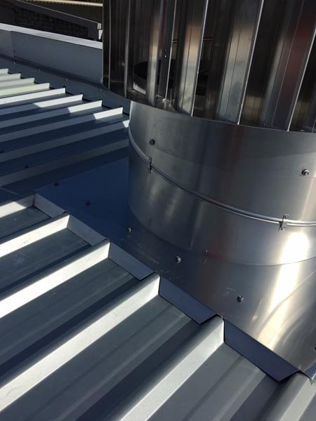 Top view of metal roof replacement  with air vent