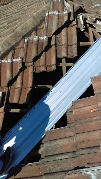 Roof valley being replaced