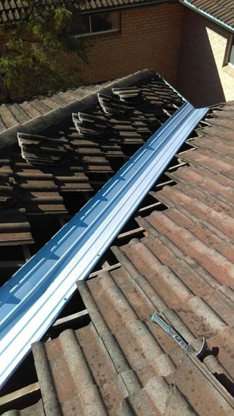 Roof valley being replaced