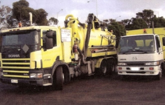 large yellow truck with hose