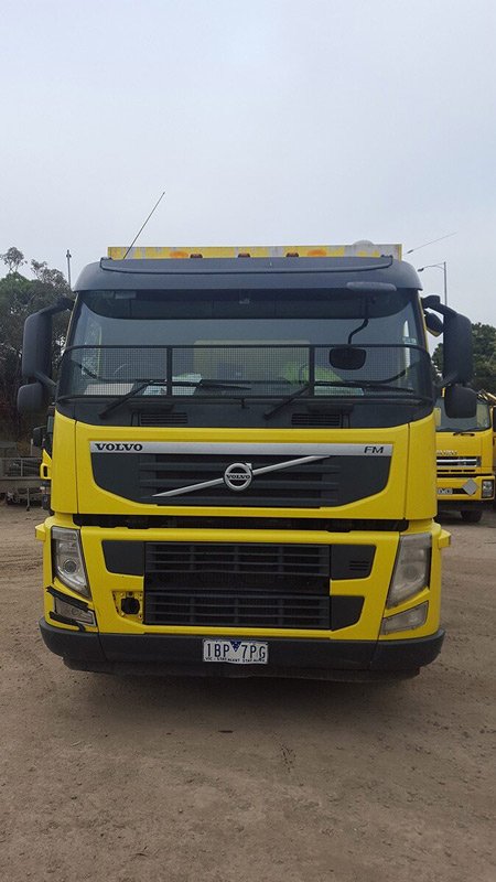 front of yellow truck