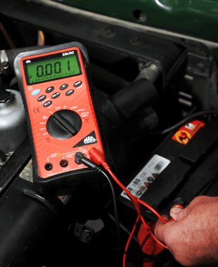 To complete your annual MOT in Rochdale call 01706 645 516 Checking the current running through a car battery