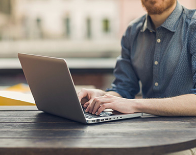 Individual working on laptop after availing the services from Mckersey IT