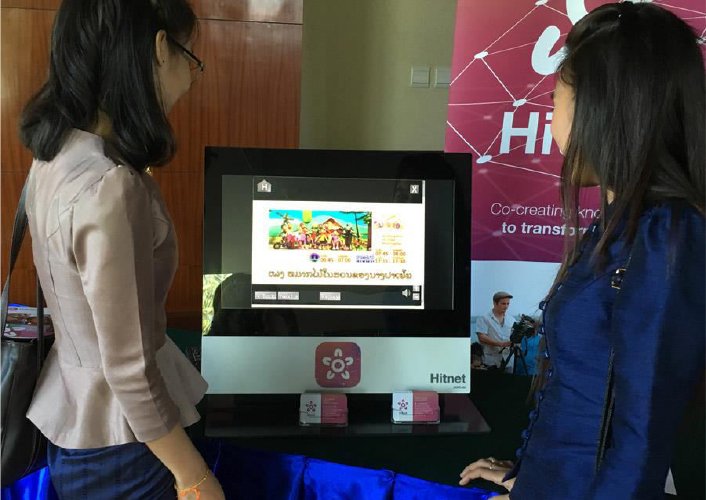 two girls looking in monitor