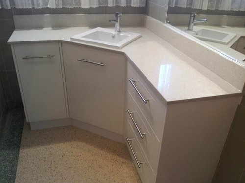 bathroom sink with white counter tops