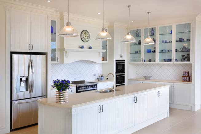 white kitchen island with white counter top