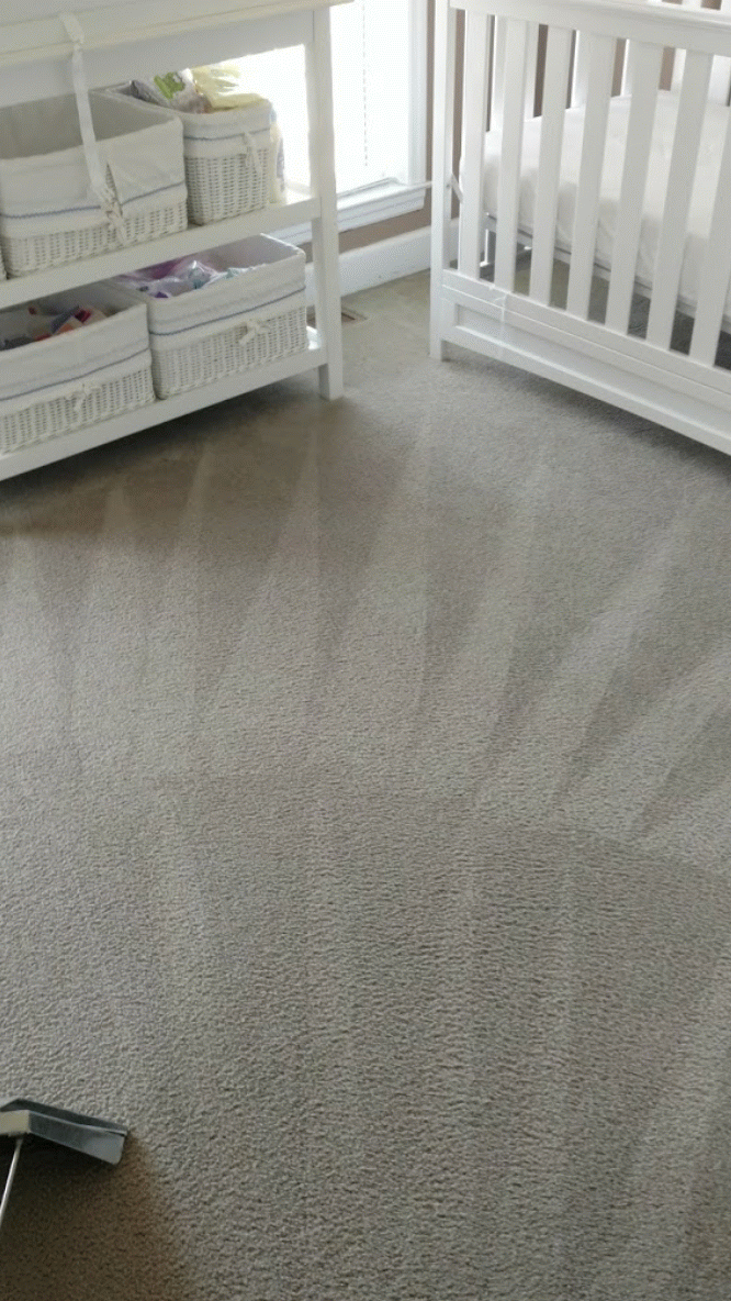 Carpet being cleaned in a nursery with a crib and changing table with baskets.