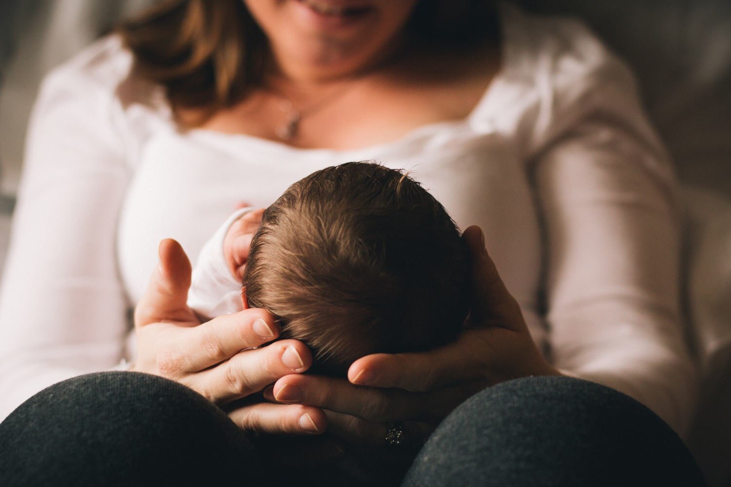 Women Holding Newborn Baby — Goulburn Physiotherapy Centre in Goulburn, NSW