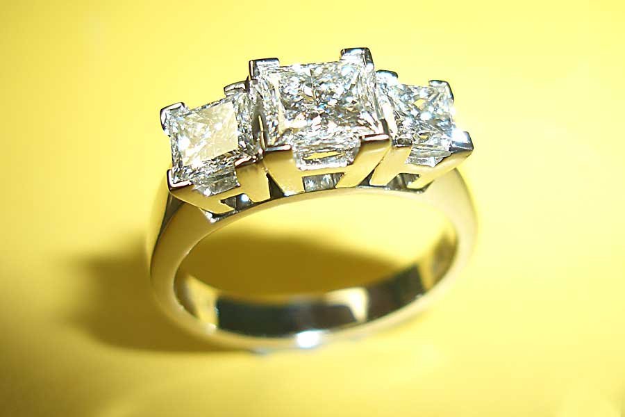 ring with trio of square-cut diamonds