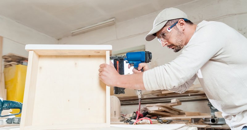 Carpenter Murrysville  Carpenter working assembling a drawer with a screwdriver