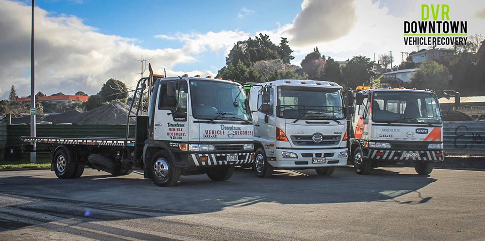 tow trucks lined up in a row