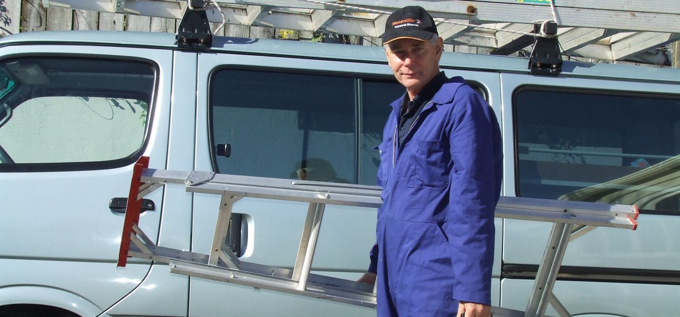 Our electrician by his van in Auckland