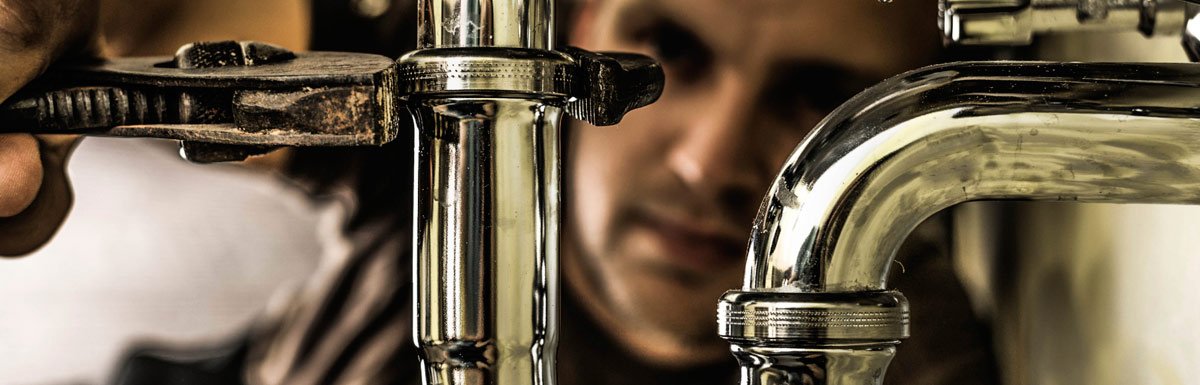 plumber with wrench