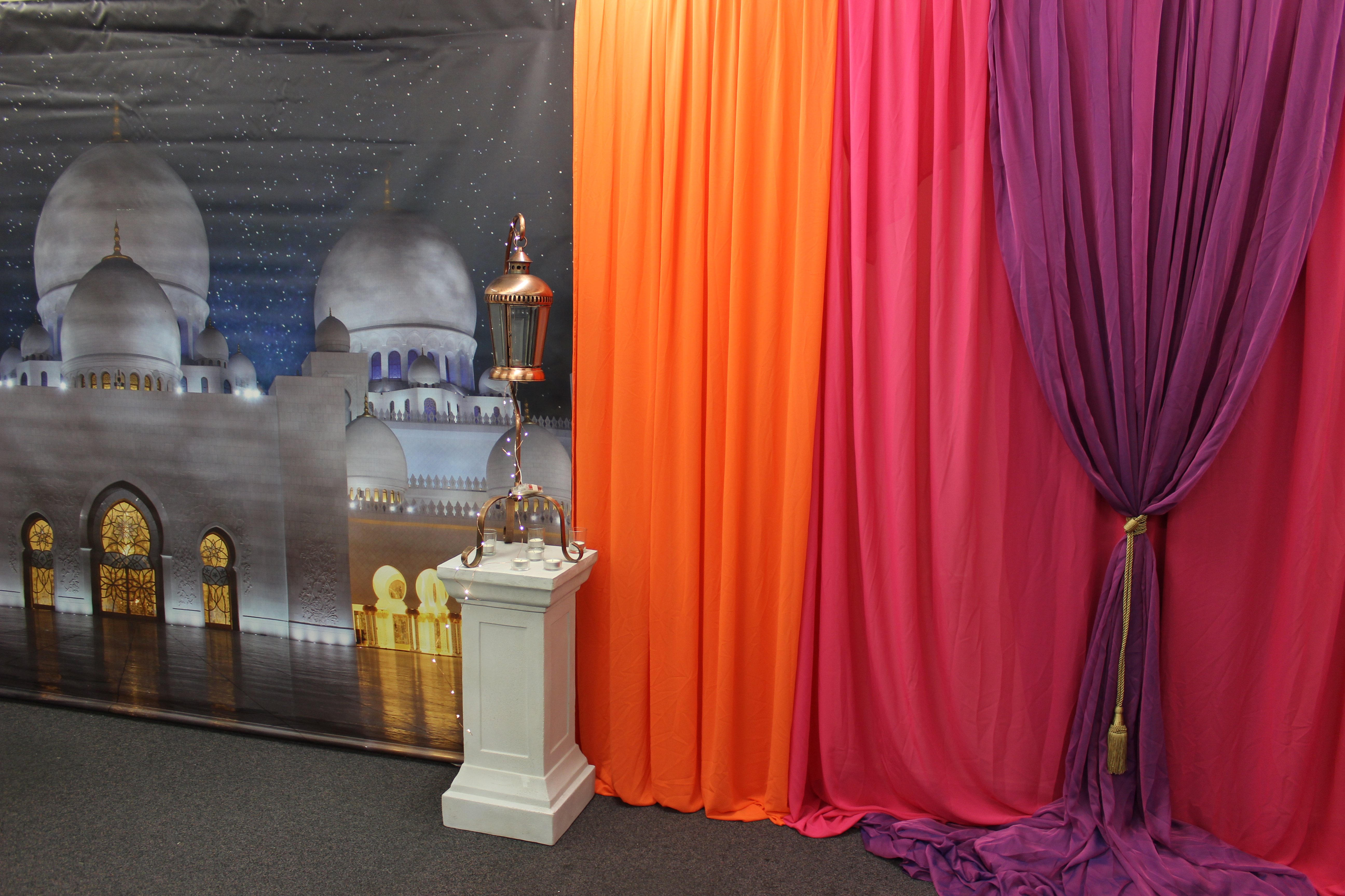 Orange, pink & purple draped backdrop