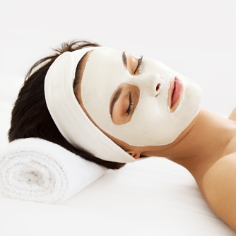 A woman with a white mask on her face