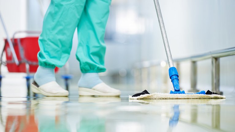 dunlops industrial and commercial cleaning cleaning ladies mopping floor close up on hands and tools