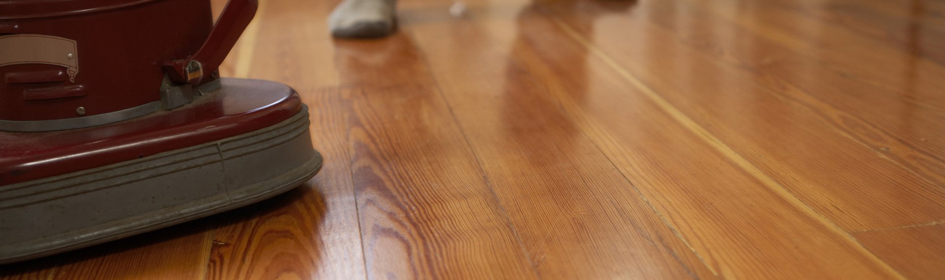 dunlops industrial and commercial cleaning man polishing wooden floor low section