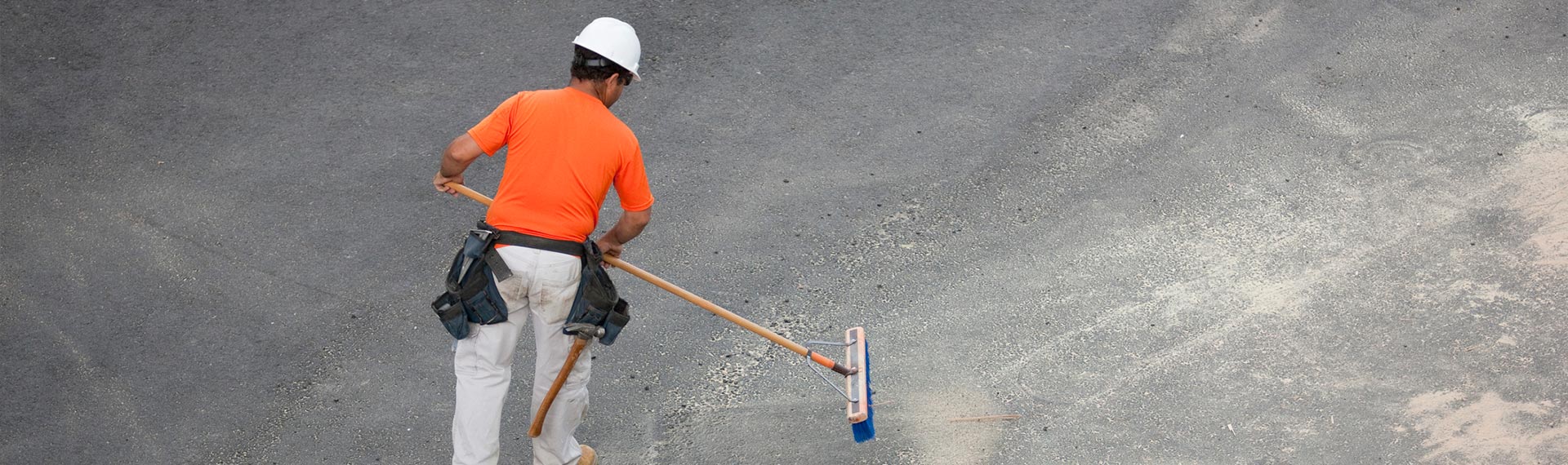 dunlops industrial and commercial cleaning portrait of male cleaner in front of cleaning worker with mop and cleaning equipment