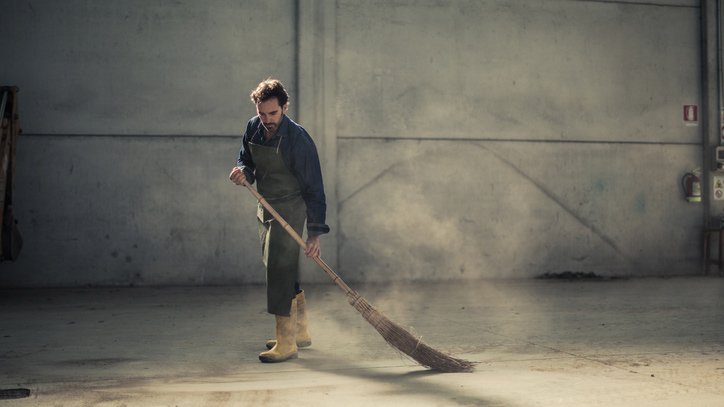 dunlops industrial and commercial cleaning worker cleaning an empty warehouse