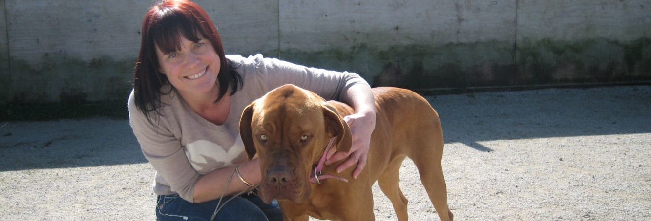 Woman and dog at the dog kennel in Stratford 