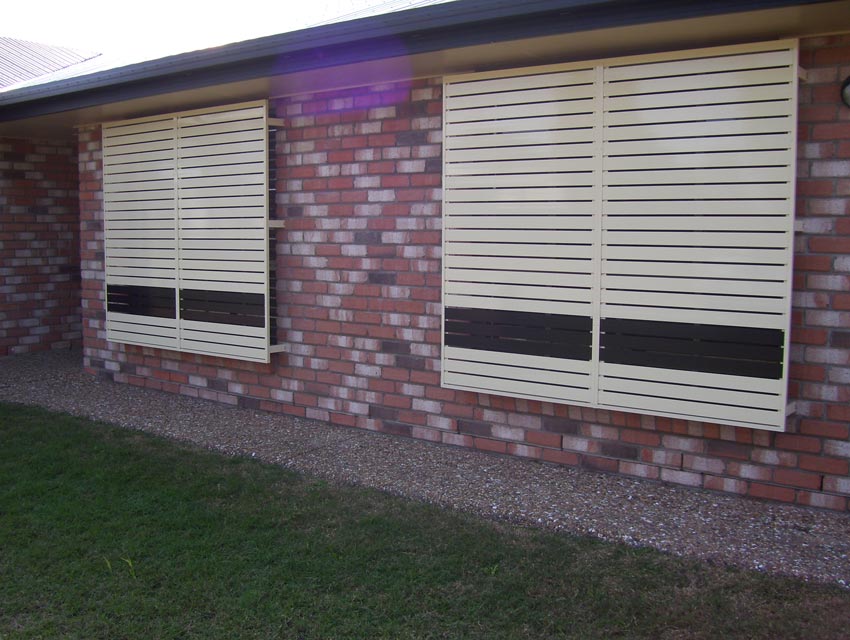 white shutters and brick house
