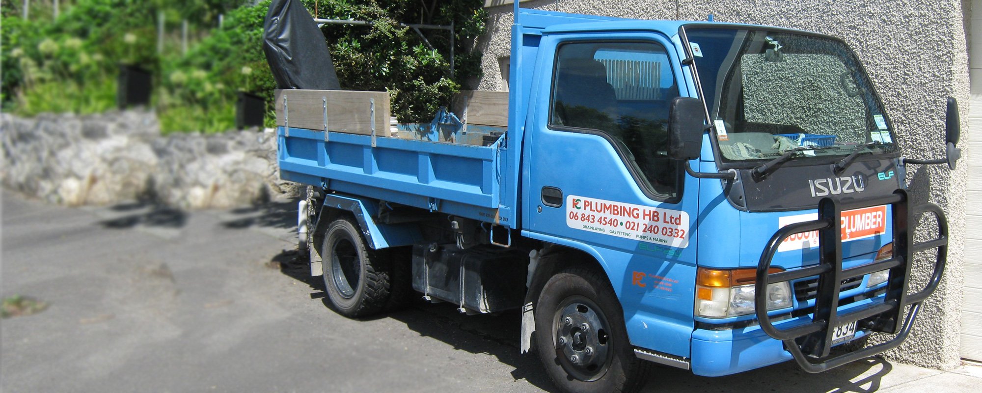 Plumbing drain laying gas fitting pumps and marine branded transportation vehicle 