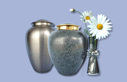 2 silver urns and flower