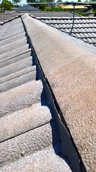 cracked cement work on the ridge capping