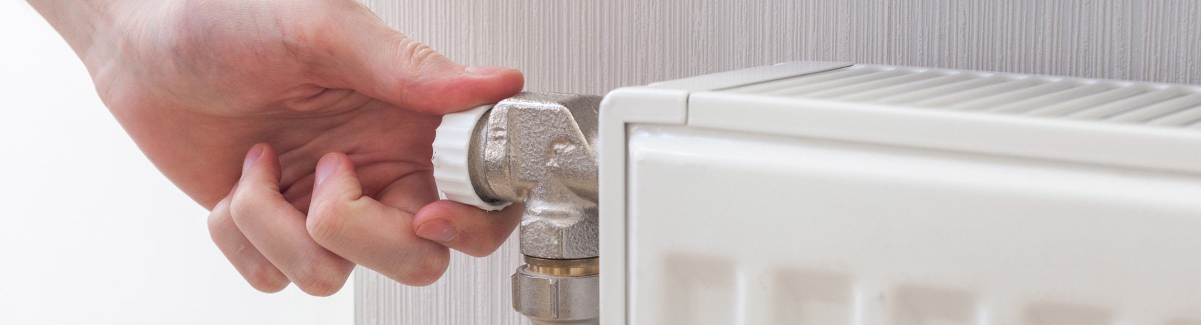 croydon plumbing and hot water man adjusting water heater temperature