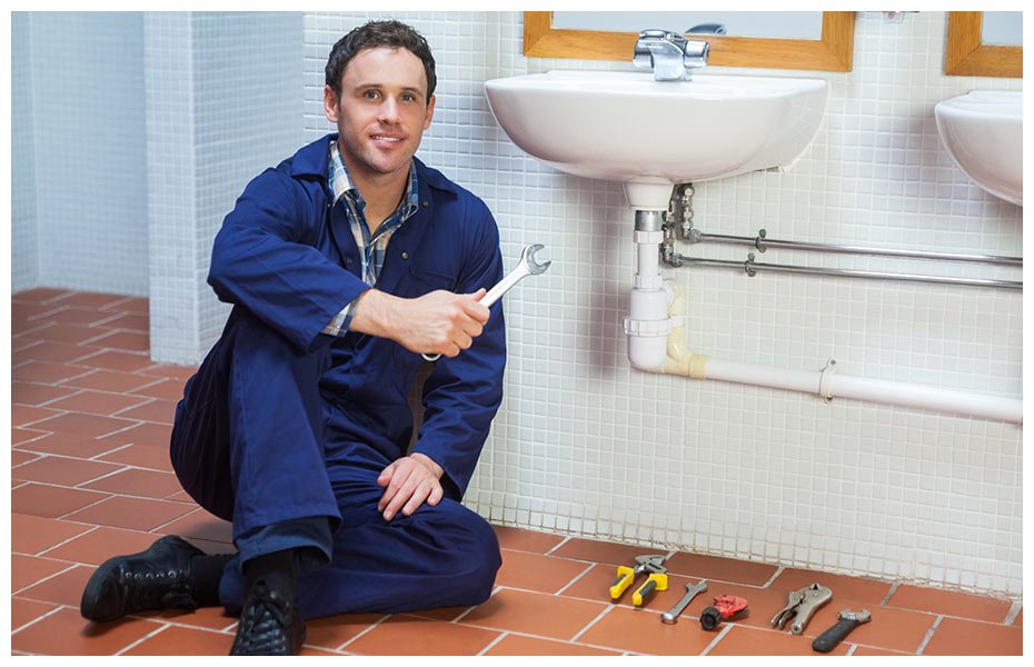 croydon plumbing and hot water plumber posing next to sink