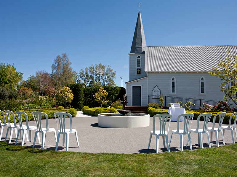 Sand and gravel being dumped by trucks on the construction site