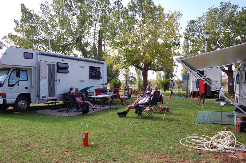 group of people outside caravan in curlwaa