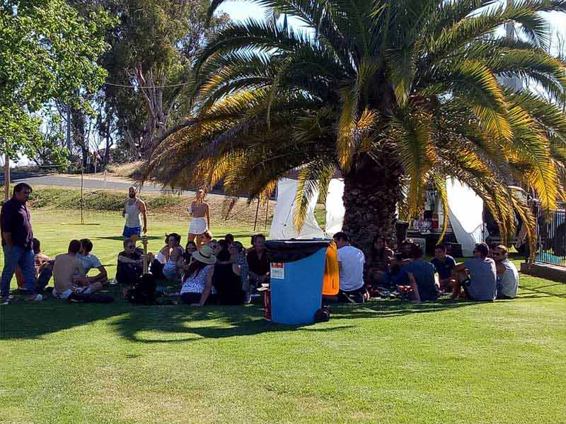 people around tree at caravan park in carlwaa