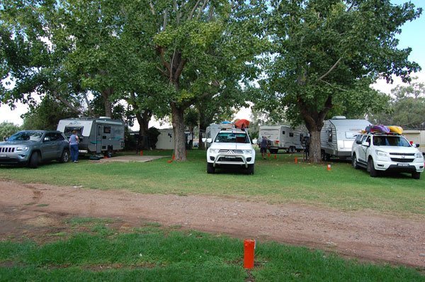 car and caravan in a park