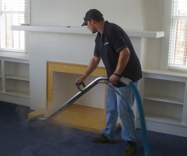launceston cleaning services man cleaning carpet A man providing professional cleaning services near Launceston