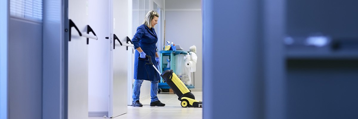 Clean Rite Cleaning Service Women at workplace, professional female cleaner washing floor in office