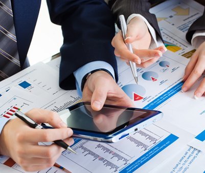 Professionals analyzing the financial reports for taxation