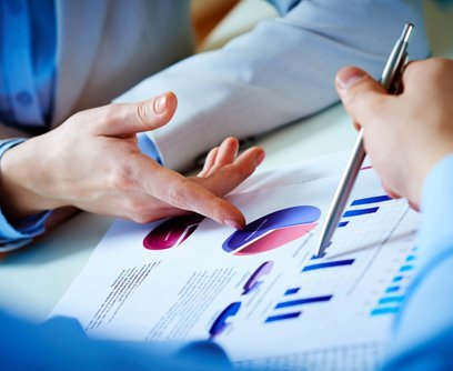 Experts analyzing business statements for taxation services