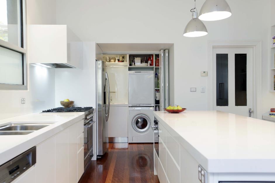 Laundry tucked away in kitchen alcove