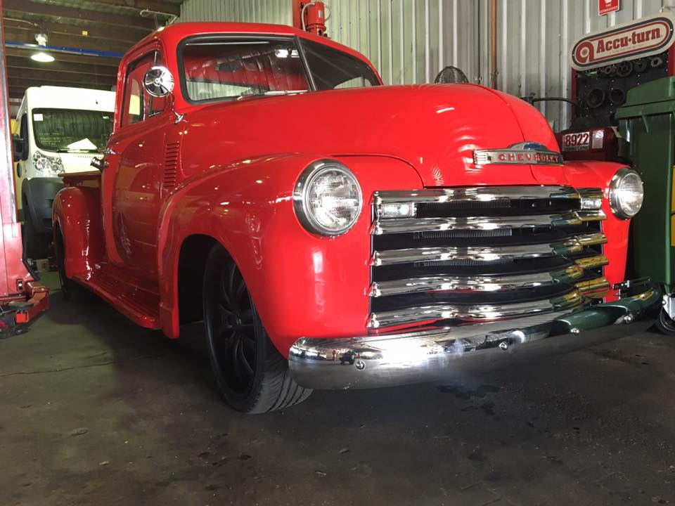 the front of a bright red car