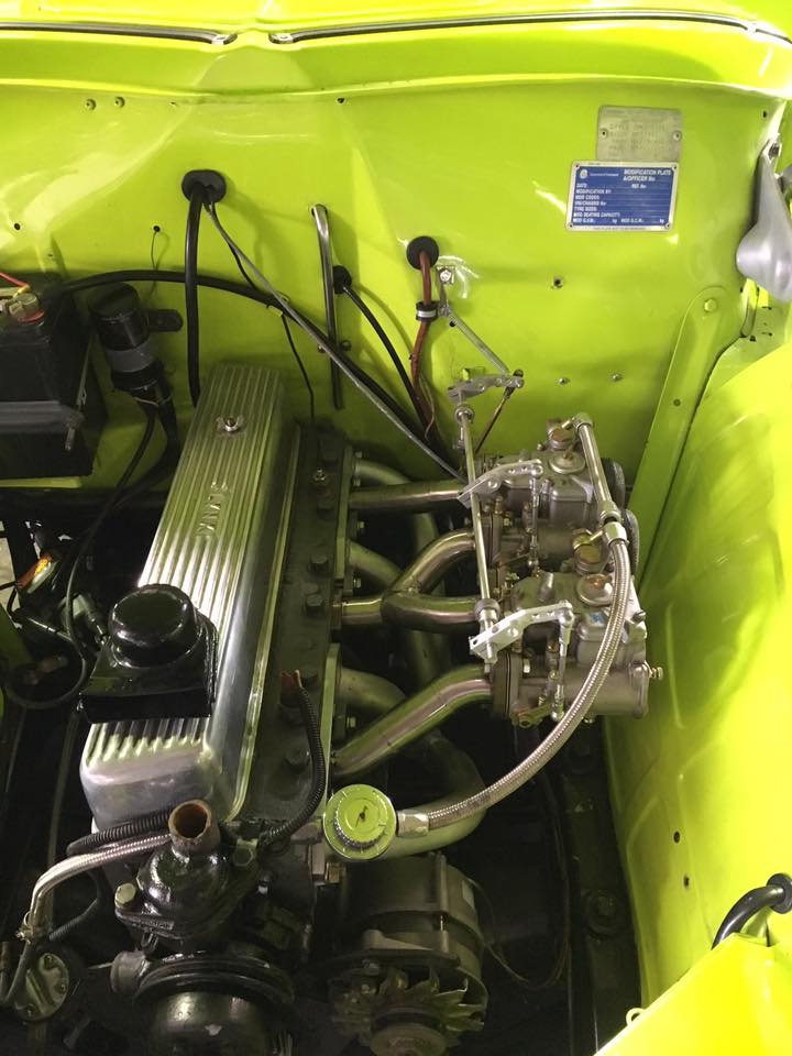 a yellow car with parts in it