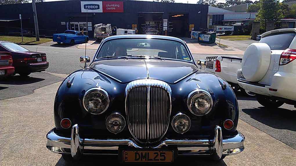 and old, dark blue car