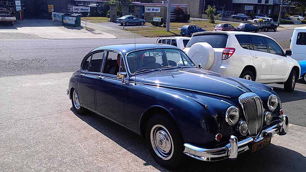 the front of a bug car that is blue