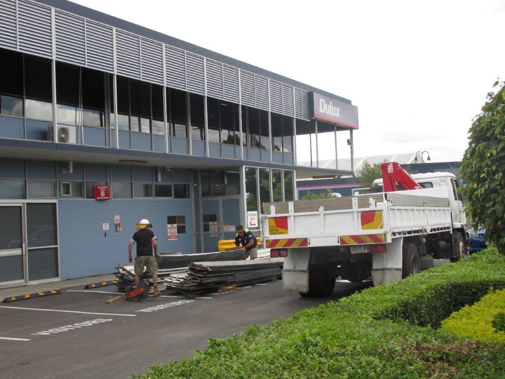 old roof sheeting being removed and disposed of from site