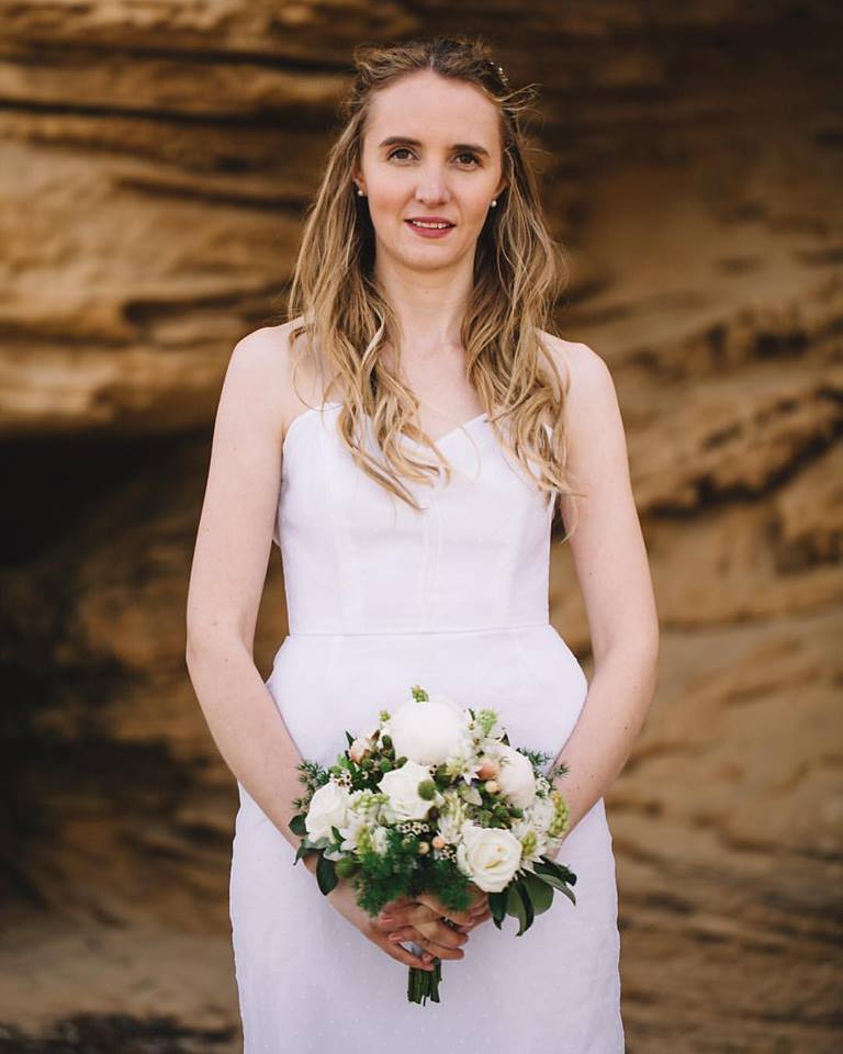 smiling woman holding bouquet