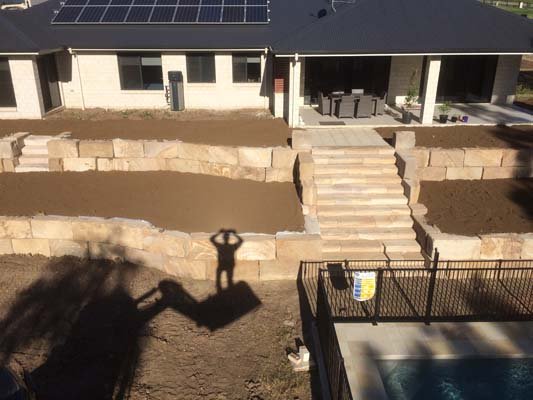 tiered sandstone walls with stairs close up