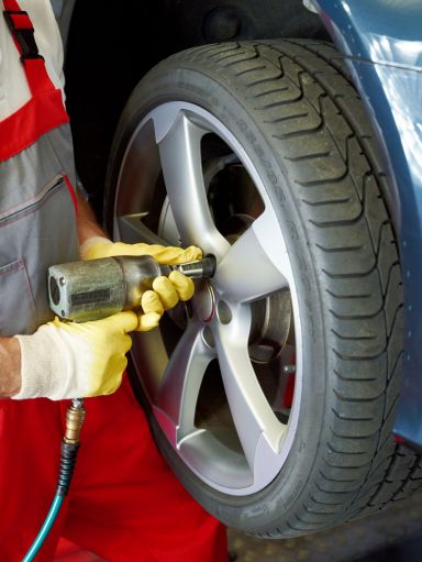 Car being serviced with new tires in Jefferson, GA